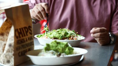 Chipotle hikes same-store sales forecast, says cyclospora fears hit sales in late July