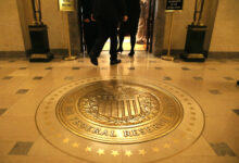 Treasury yields are little changed as investors await key inflation data