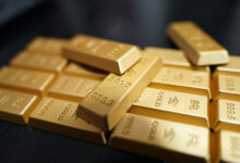Gold price hovers at three-month high on dollar weakness, Treasury bond buyback plans